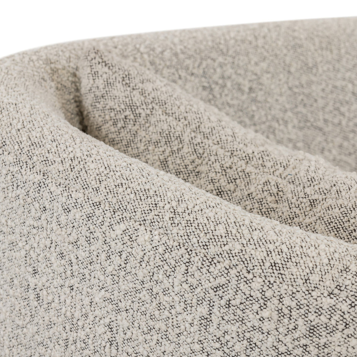 Close-up view of the Magnolia Swivel Chair in Knoll Domino fabric texture.
