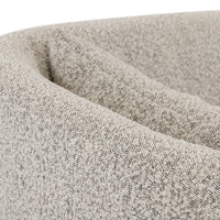 Close-up view of the Magnolia Swivel Chair in Knoll Domino fabric texture.