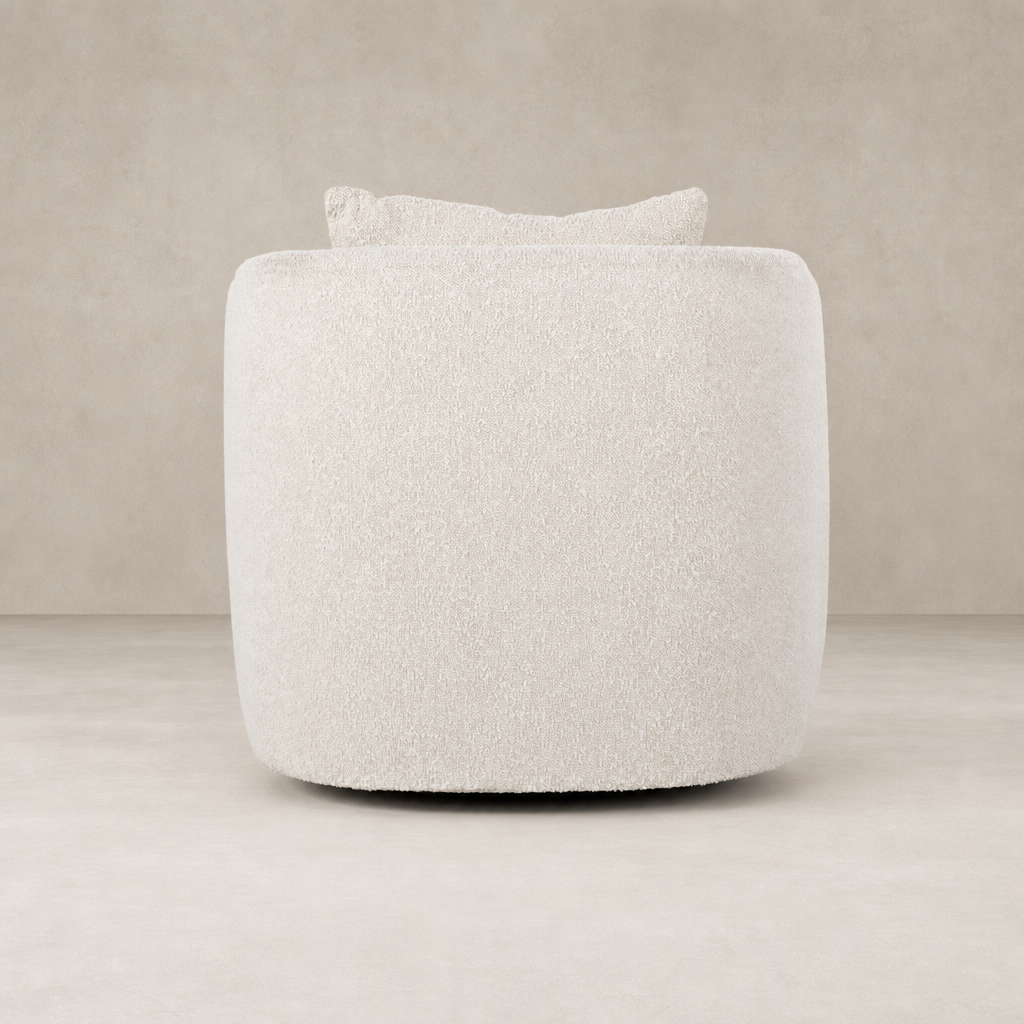 Magnolia Swivel Chair in Knoll Natural featuring a plush, rounded shape with a soft texture.