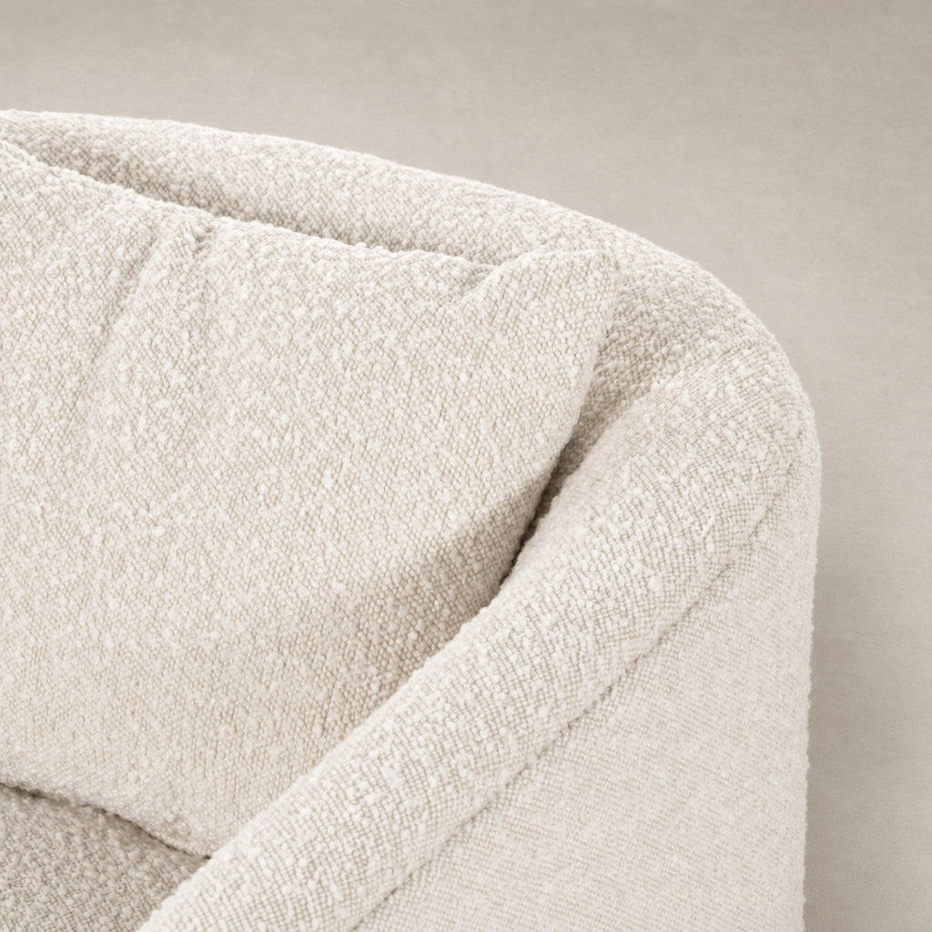 Magnolia Swivel Chair in Knoll Natural, featuring soft textured upholstery and curved edges.