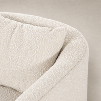 Magnolia Swivel Chair in Knoll Natural, featuring soft textured upholstery and curved edges.