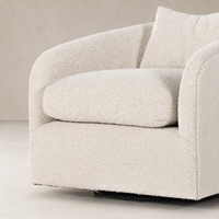Magnolia Swivel Chair in Knoll Natural featuring plush, textured upholstery and rounded silhouette.