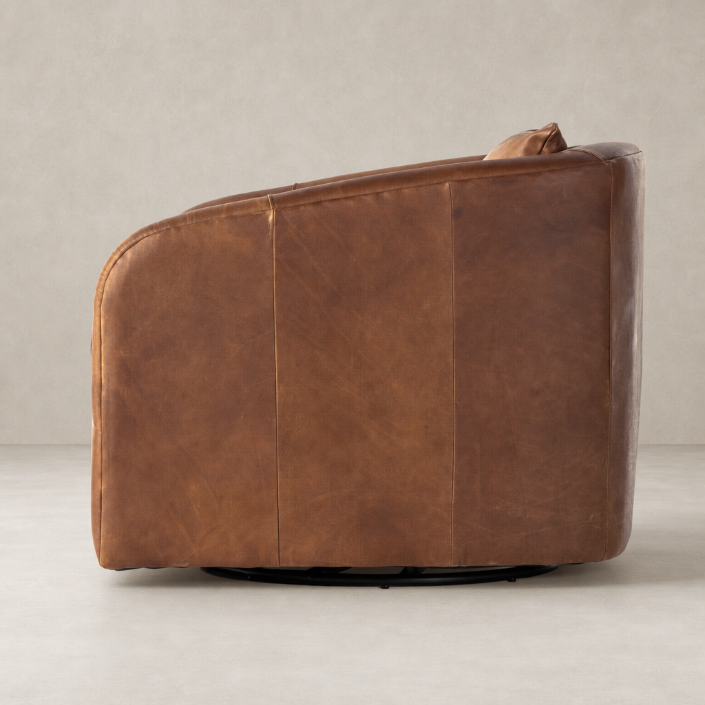 Magnolia Swivel Chair in Heirloom Sienna showcasing a smooth, rounded design.