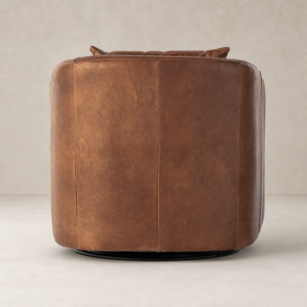 Magnolia Swivel Chair in Heirloom Sienna featuring a rounded design and plush leather finish.