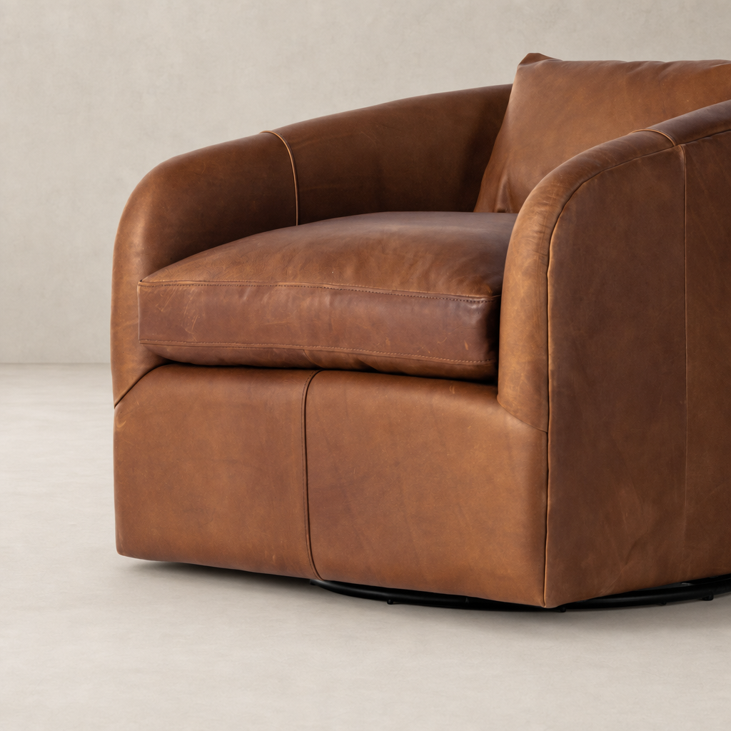 Magnolia Swivel Chair in Heirloom Sienna with plush leather upholstery and curved arms.