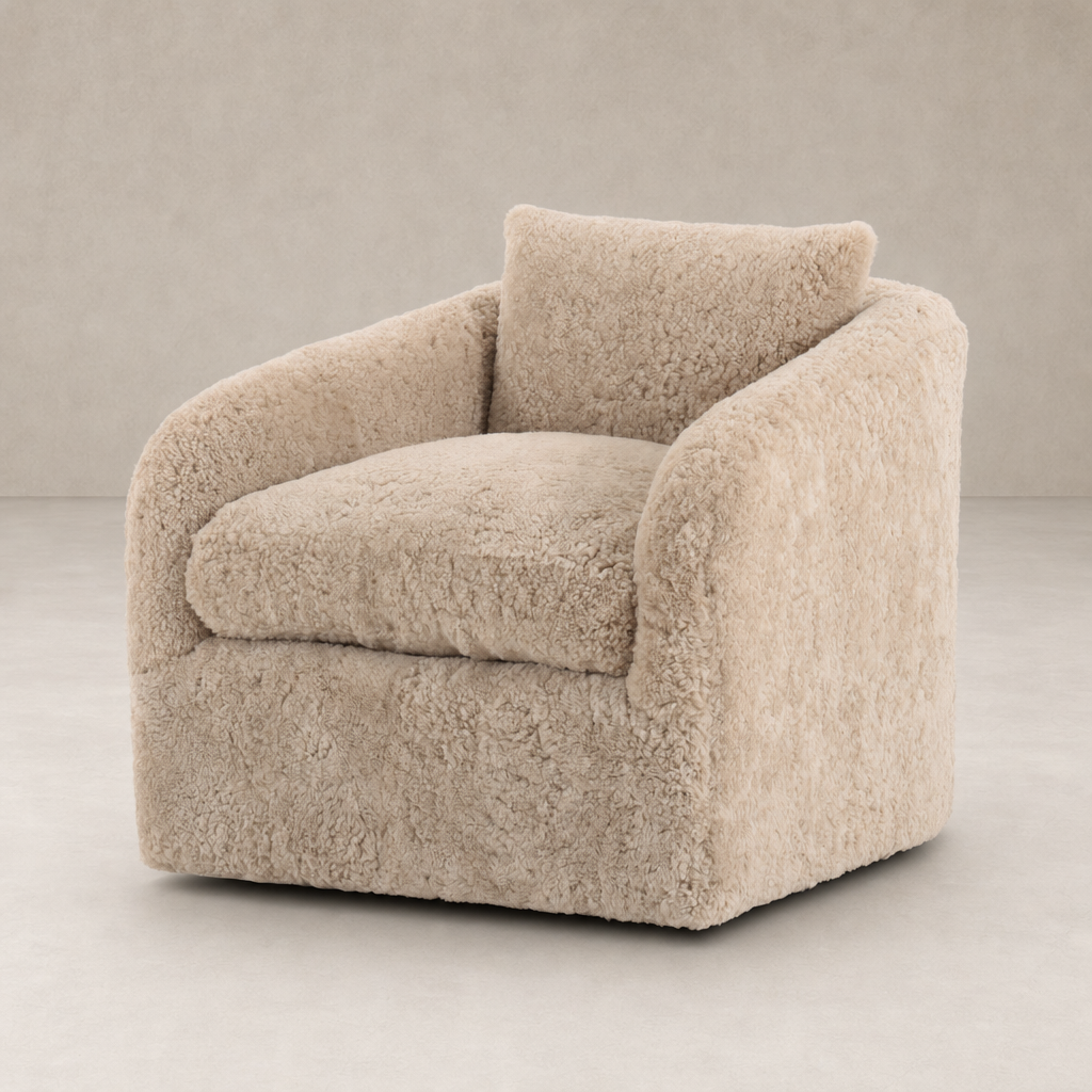 Magnolia Swivel Chair in beige shearling, featuring plush upholstery and curved silhouette.