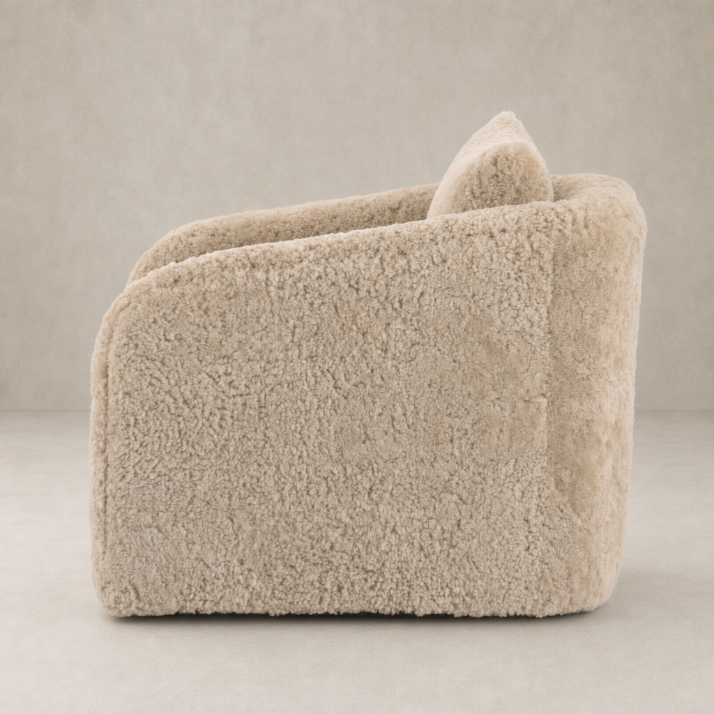 Beige shearling Magnolia Swivel Chair featuring a soft, rounded design and cozy texture.