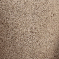 Close-up of beige shearling texture from the Magnolia Swivel Chair.