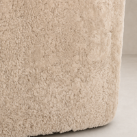 Beige shearling texture of the Magnolia Swivel Chair, showcasing its luxurious softness.