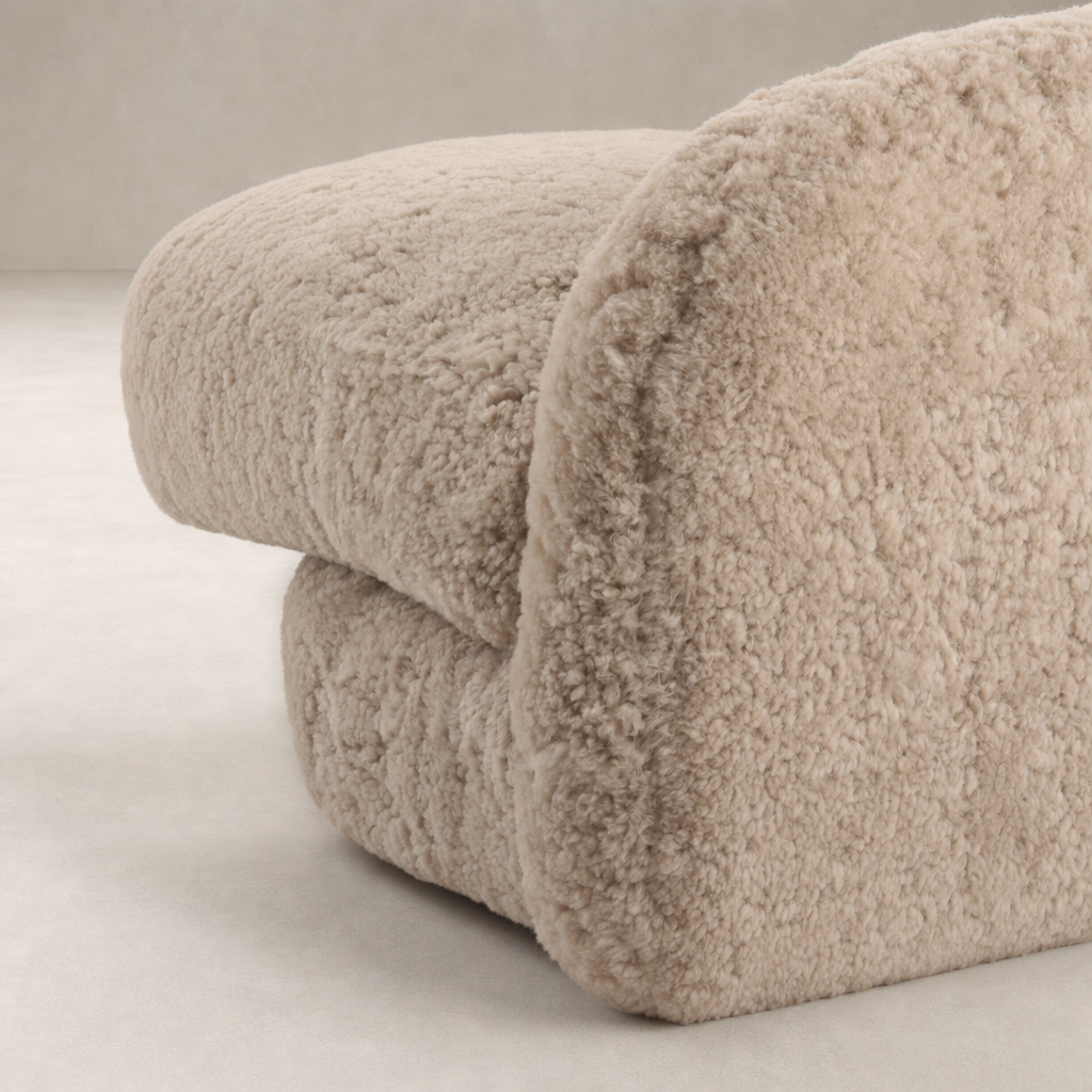 Beige shearling Magnolia Swivel Chair showcasing its plush, rounded design and soft texture.