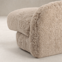 Beige shearling Magnolia Swivel Chair showcasing its plush, rounded design and soft texture.