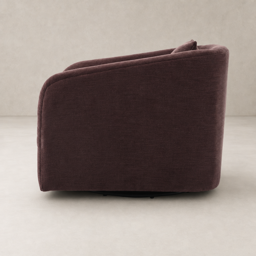 Magnolia Swivel Chair in Laughlin Plum with curved back and soft upholstery.