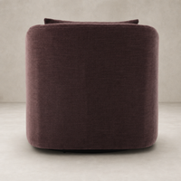 Magnolia Swivel Chair in Laughlin Plum featuring a rounded, modern design and plush upholstery.
