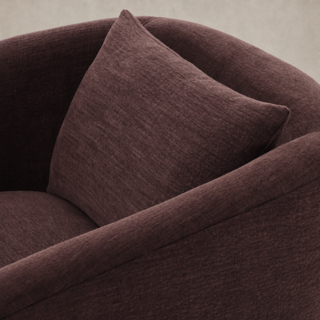 Magnolia Swivel Chair in Laughlin Plum with a cozy, textured fabric and plush cushion.