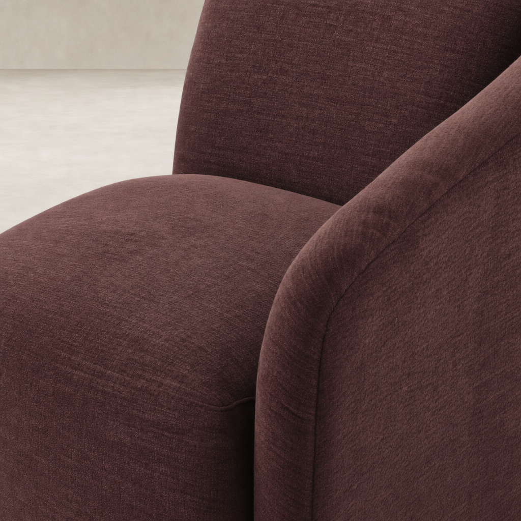 Magnolia Swivel Chair in Laughlin Plum featuring soft, textured upholstery and rounded arms.