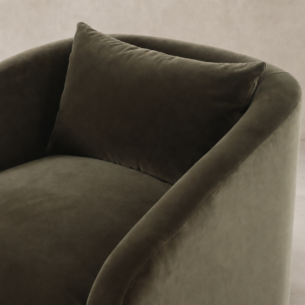 Magnolia Swivel Chair in Surrey Olive with plush velvet upholstery and curved arms.