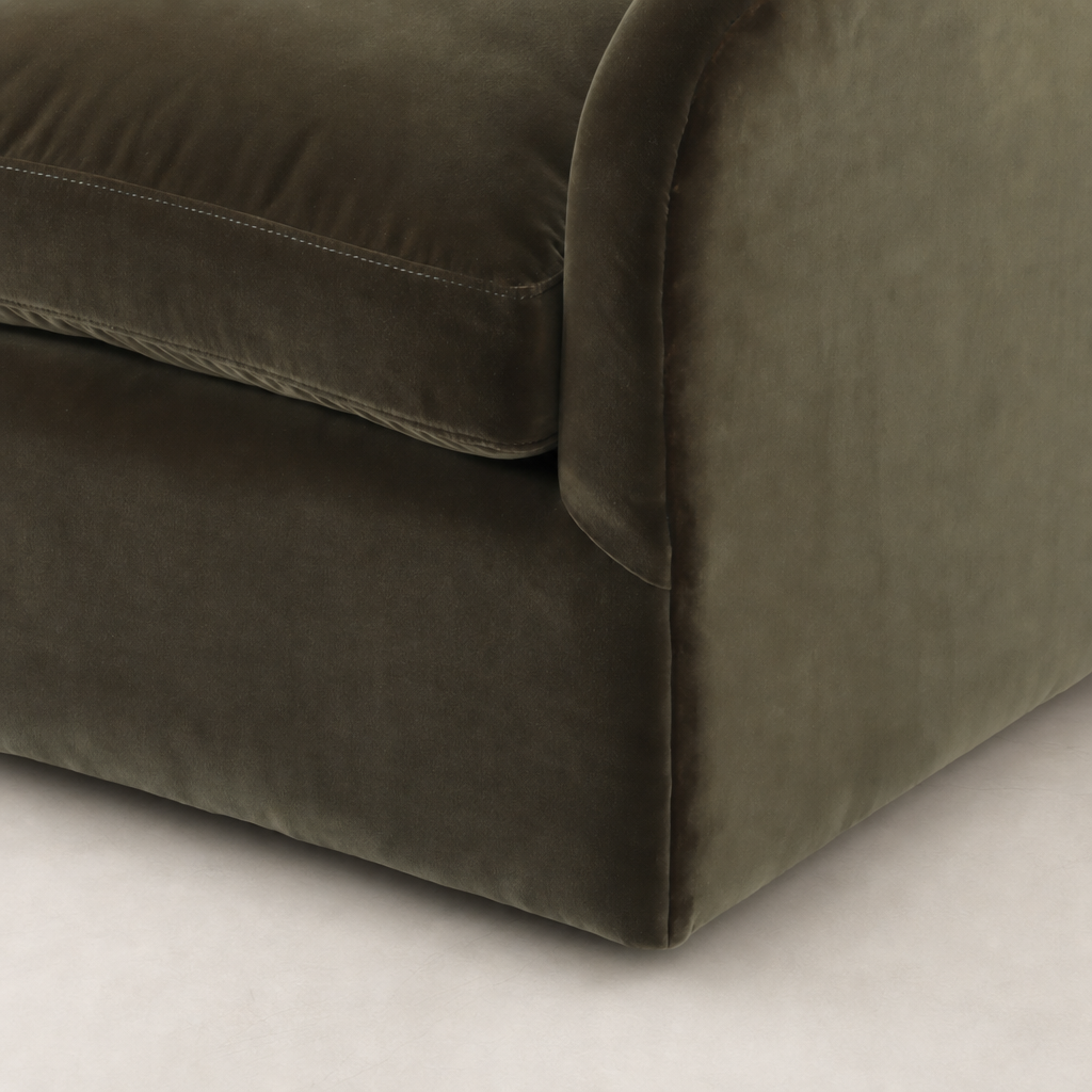 Surrey Olive Magnolia Swivel Chair showcasing plush velvet fabric and rounded corner design.