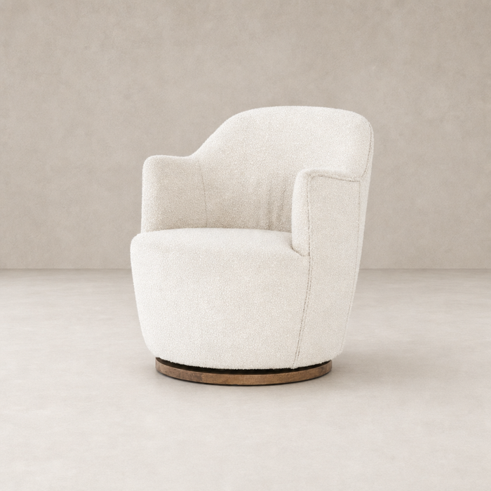 Comfortable Soliel swivel chair in Knoll Natural upholstery with rounded design.
