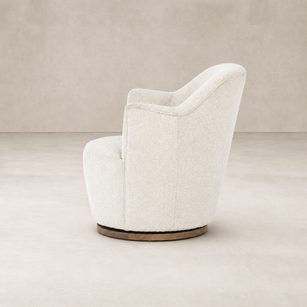 Soliel Swivel Chair in Knoll Natural upholstery with a curved silhouette and wooden base.