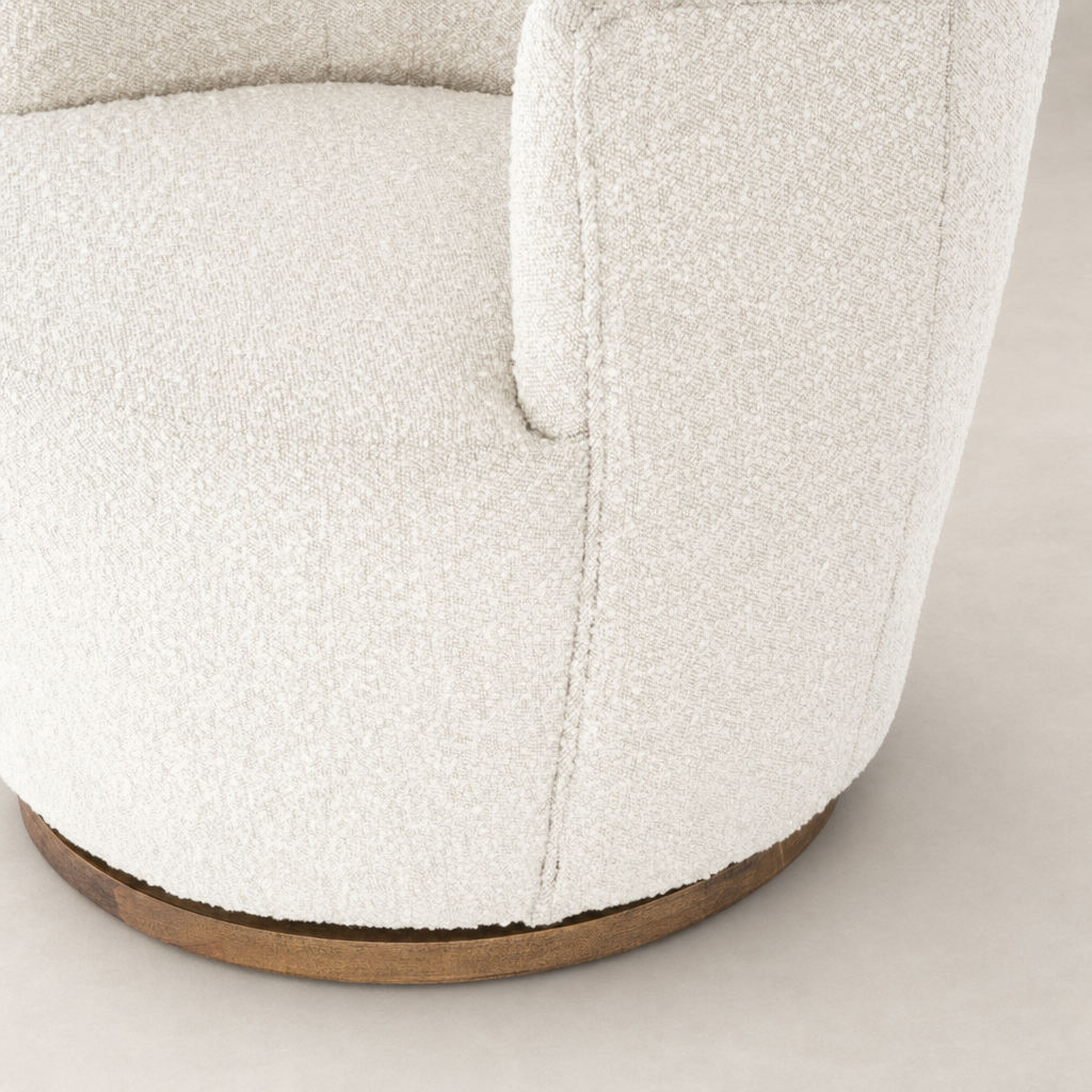 Close-up of the Soliel Swivel Chair in Knoll Natural, highlighting its soft texture and wooden base.
