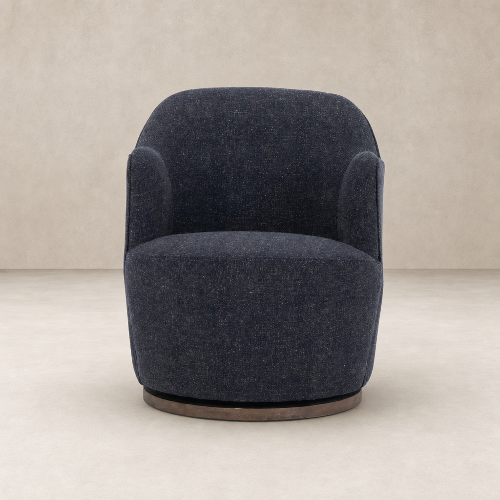 Soliel Swivel Chair in Thames Slate with a rounded design and soft upholstery.
