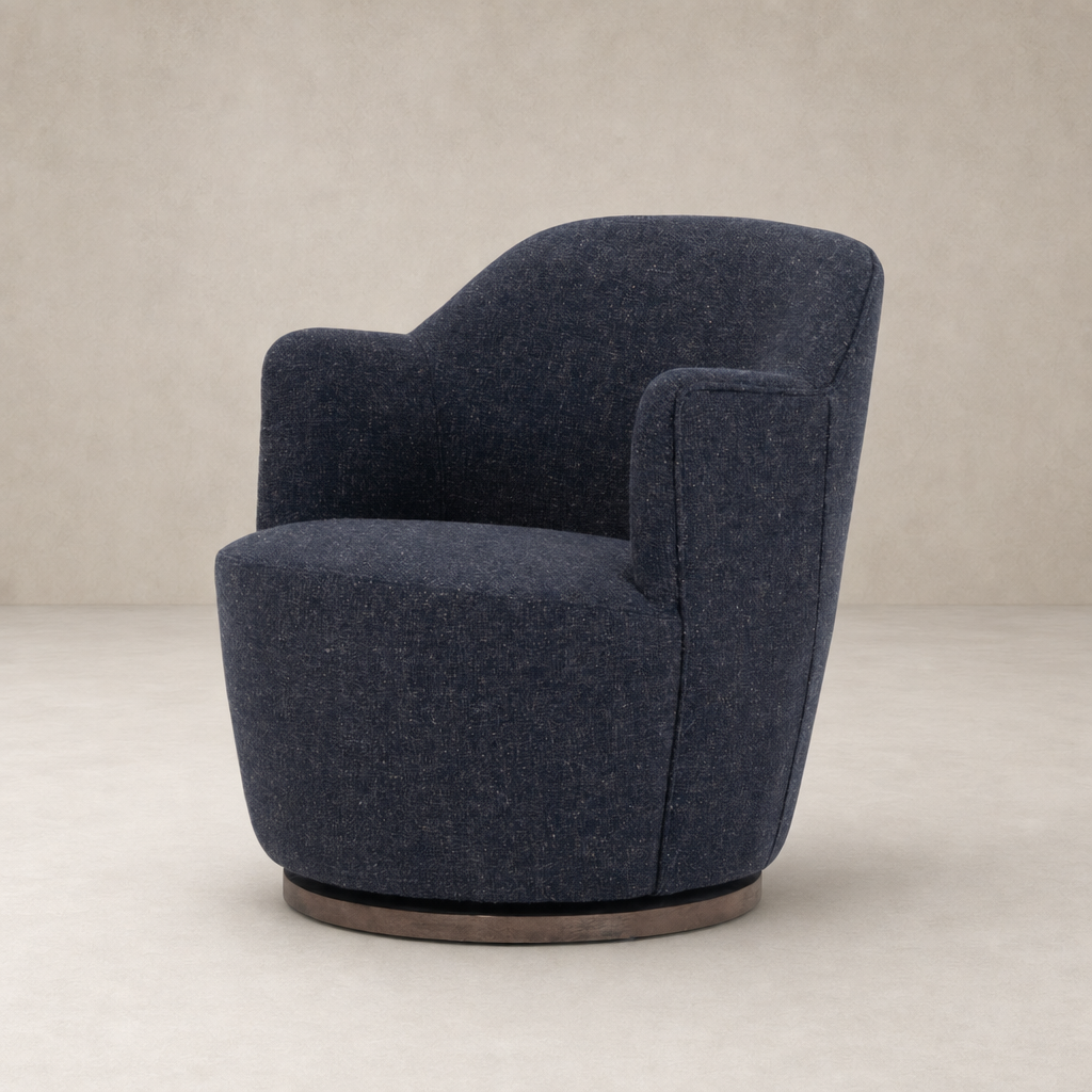 Soliel Swivel Chair in Thames Slate with a rounded silhouette and plush upholstery.