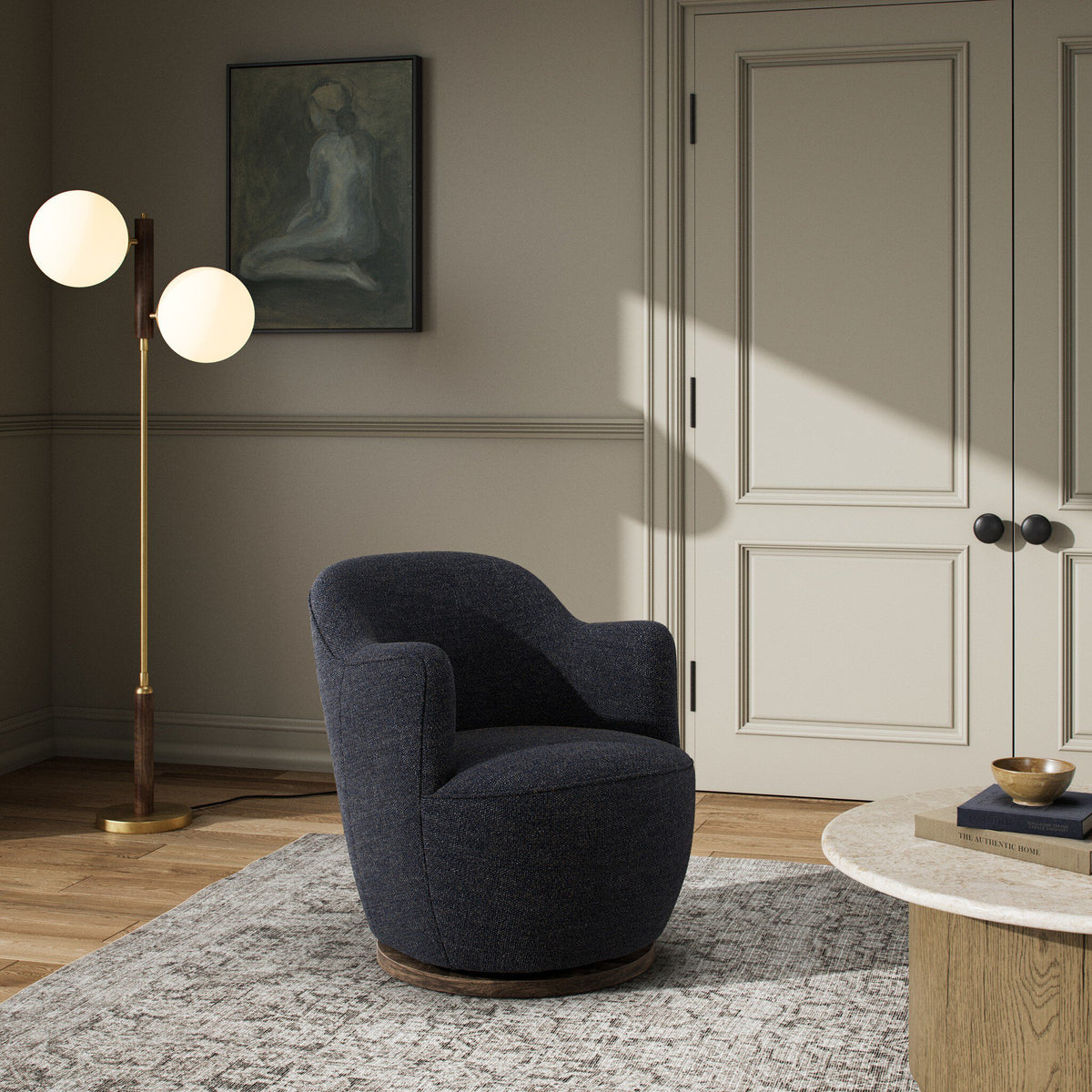 Soliel Swivel Chair in Thames Slate features a soft, rounded design and cozy upholstery.