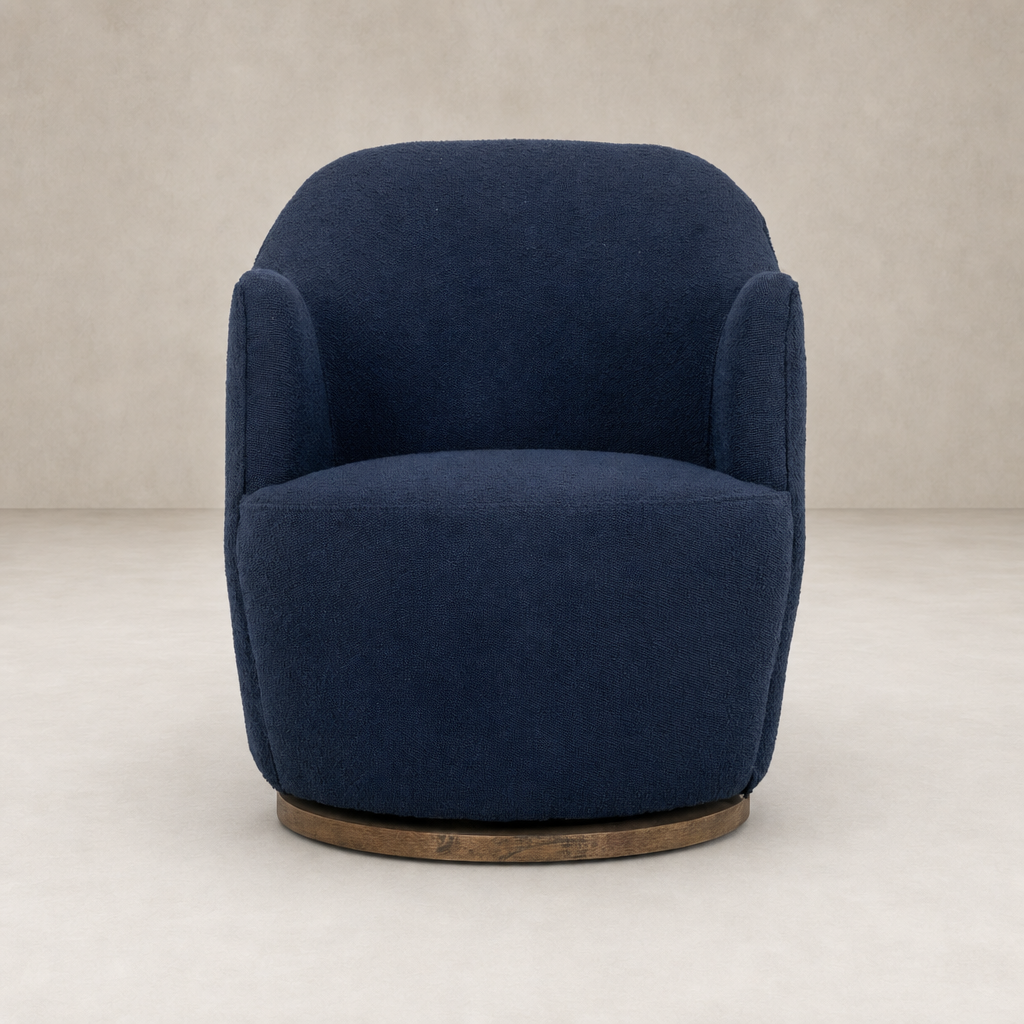 Copenhagen Indigo Soliel Swivel Chair with plush fabric and rounded design.
