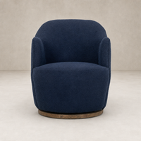 Copenhagen Indigo Soliel Swivel Chair with plush fabric and rounded design.