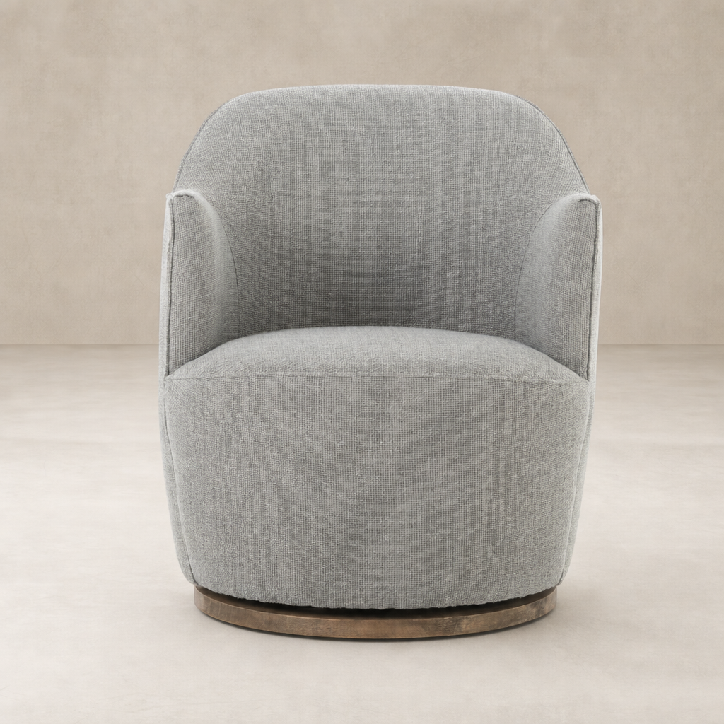 Soliel Swivel Chair in Gibson Silver with a rounded, plush design and wooden base.