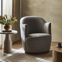 Soliel Swivel Chair in Gibson Silver, featuring a rounded design and textured upholstery.