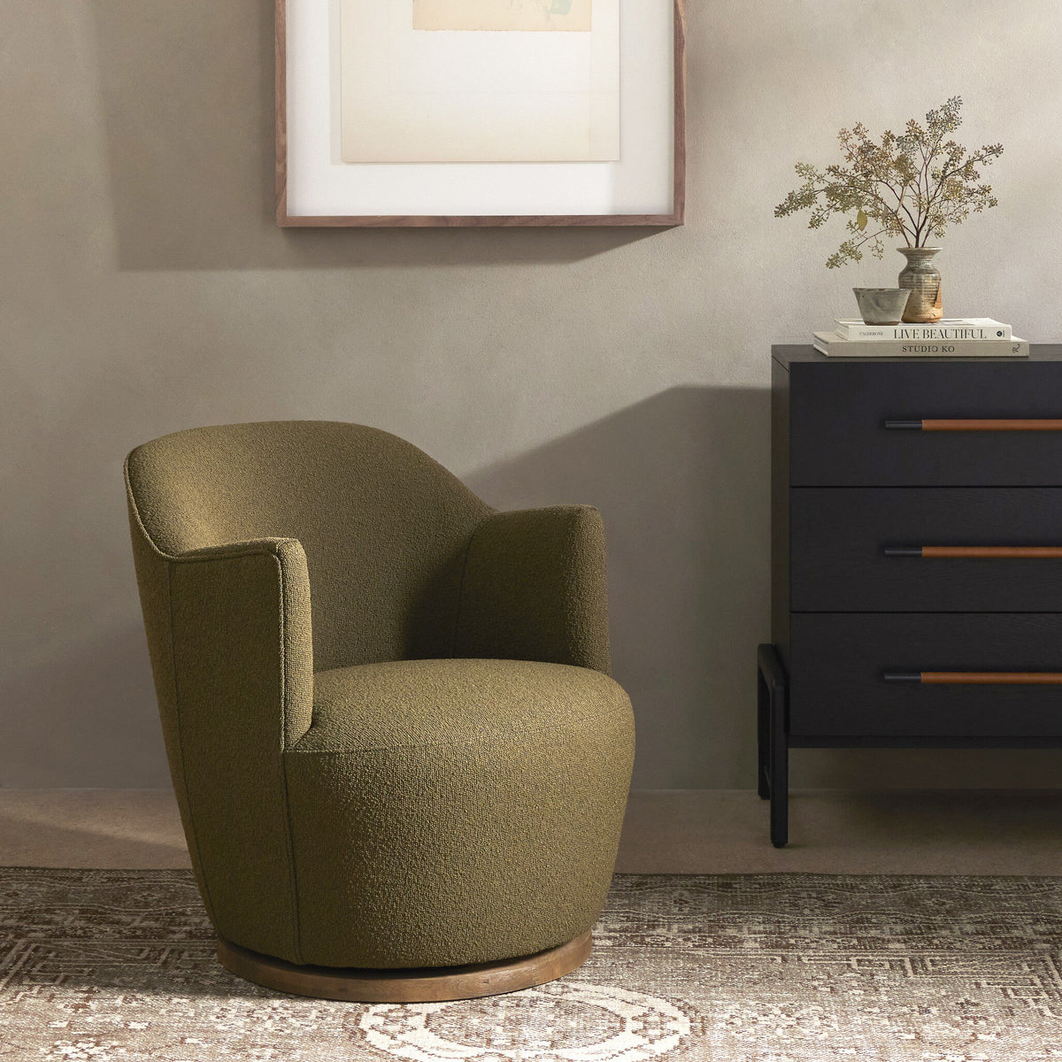 Soliel Swivel Chair in Fiqa Boucle Olive with a contemporary rounded design.