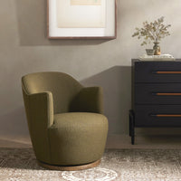 Soliel Swivel Chair in Fiqa Boucle Olive with a contemporary rounded design.