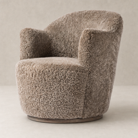 Taupe shearling Soliel swivel chair featuring a rounded shape and plush texture.