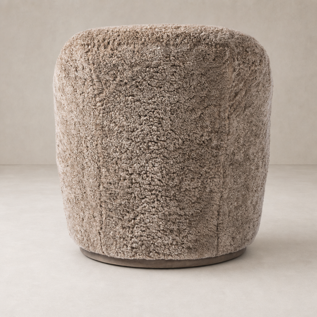 Taupe shearling Soliel Swivel Chair with a plush, rounded design for comfort.
