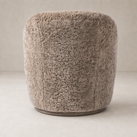 Taupe shearling Soliel Swivel Chair with a plush, rounded design for comfort.
