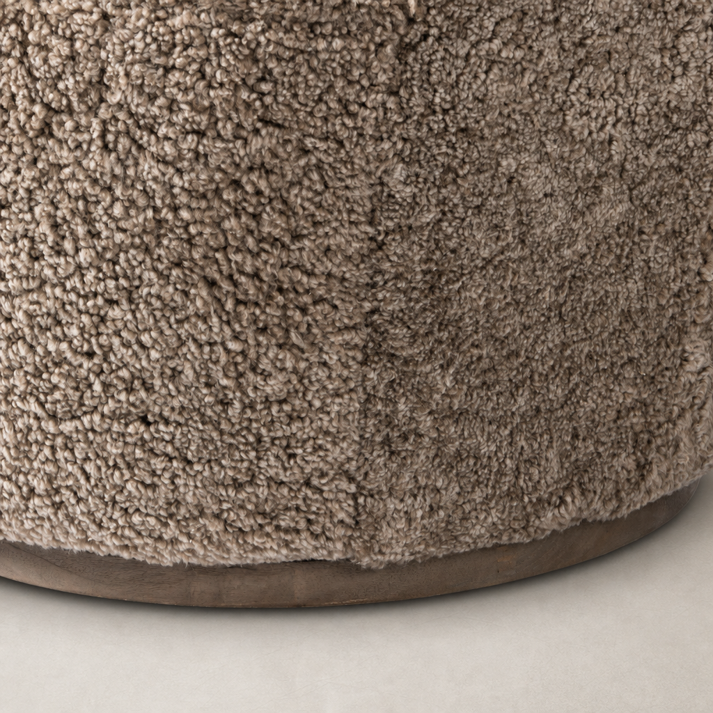 Taupe shearling texture of the Soliel Swivel Chair's soft upholstery close-up.