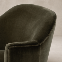 Surrey Olive Soliel Swivel Chair featuring a smooth curved back and soft upholstery.