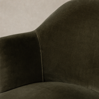 Surrey Olive Soliel Swivel Chair showcasing soft fabric texture and curved silhouette.