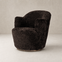 Cocoa shearling Soliel Swivel Chair with plush, rounded design and metallic base.