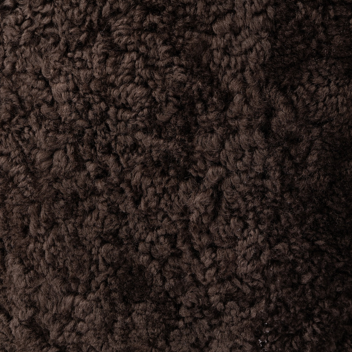 Cocoa shearling texture of the Soliel Swivel Chair, showcasing its soft, plush surface.