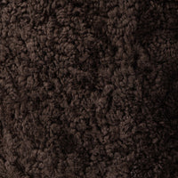 Cocoa shearling texture of the Soliel Swivel Chair, showcasing its soft, plush surface.