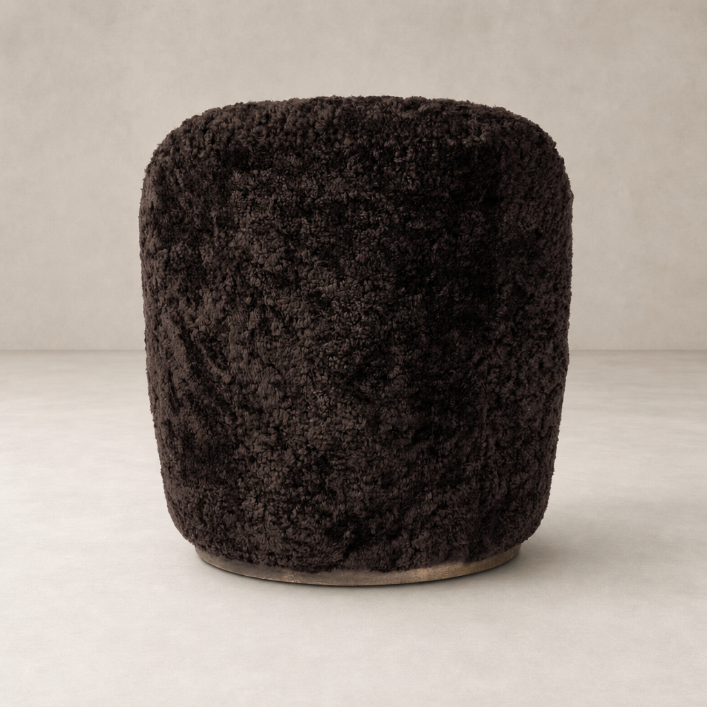 Cocoa shearling Soliel Swivel Chair with a plush textured finish and rounded design.