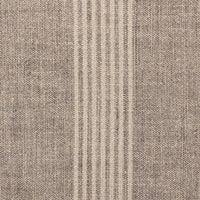Detail of the Bilbury Large Round Ottoman showcasing its textured fabric in neutral tones.