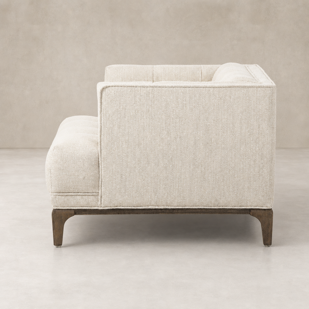Side view of Murano Chair in Kerbey Taupe showcasing its sleek design and textured fabric.