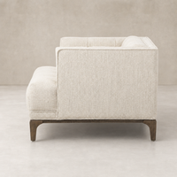 Side view of Murano Chair in Kerbey Taupe showcasing its sleek design and textured fabric.