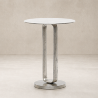 Rowan End Table featuring a sleek round top and a unique curved metal base.