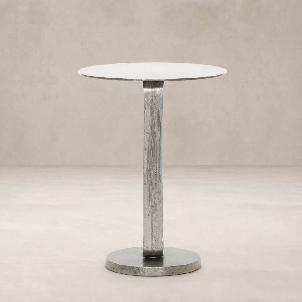 Rowan End Table features a sleek round top and textured metallic base.