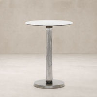 Rowan End Table features a sleek round top and textured metallic base.