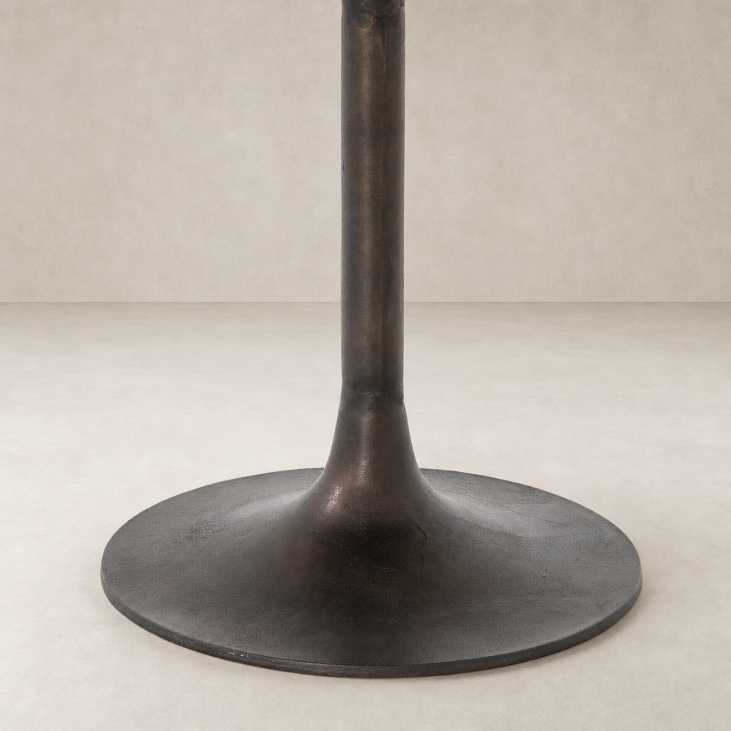 Antique Rust Kensington Bistro Table featuring a sleek, round base and sturdy support.
